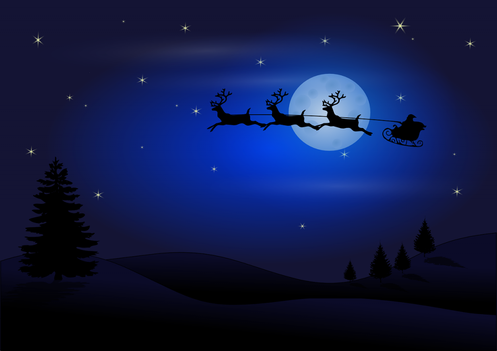 Santa in his sleigh with reindeers