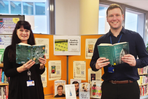 Library staff holding books to celebrate Reading Influencer Week